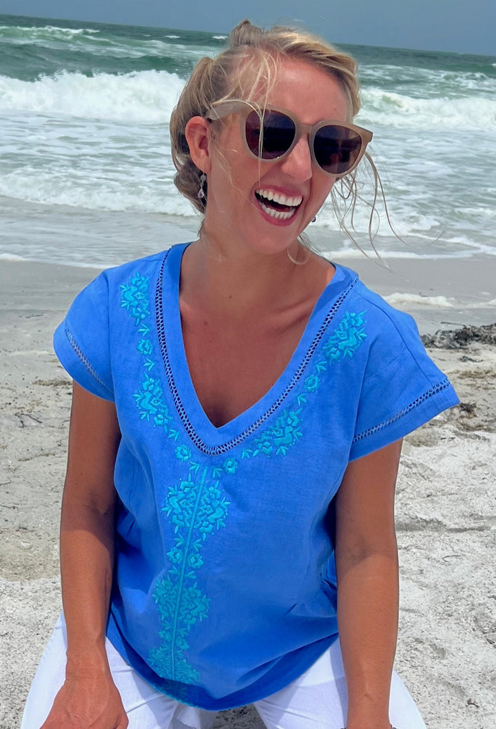 woman in 100% handspun, hand-woven cotton top on the beach