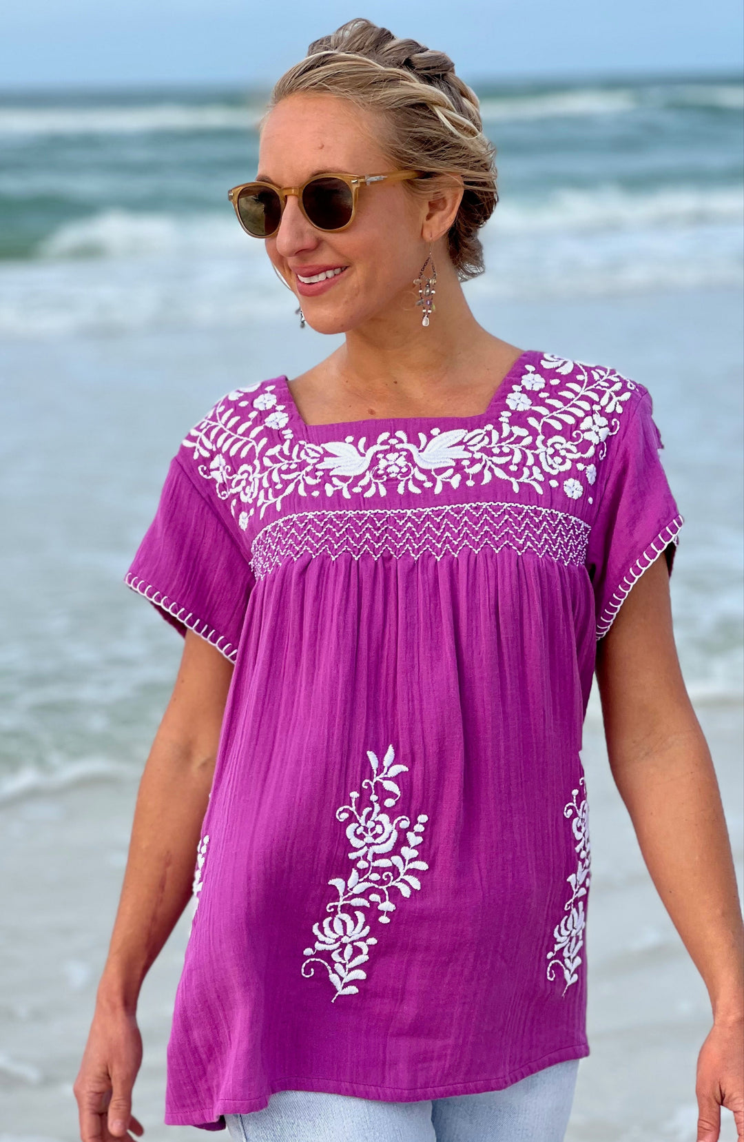 woman in purple tunic