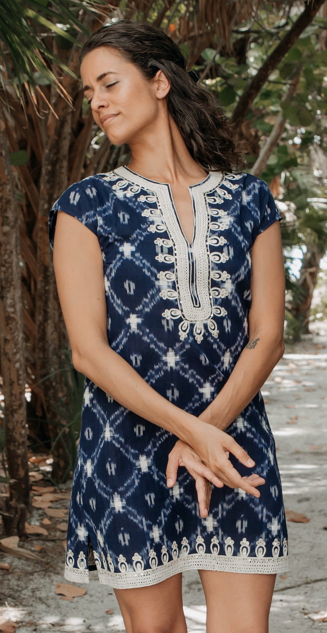 woman in authentic ikat textile tunic