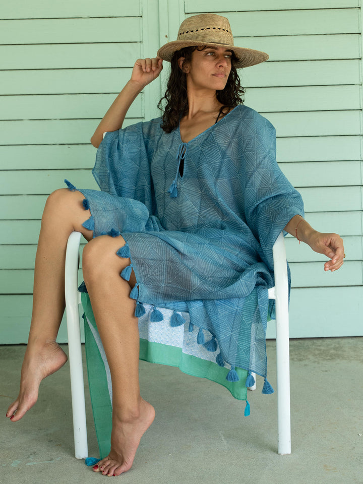 woman in kaftan with tassels by sigrid olsen 