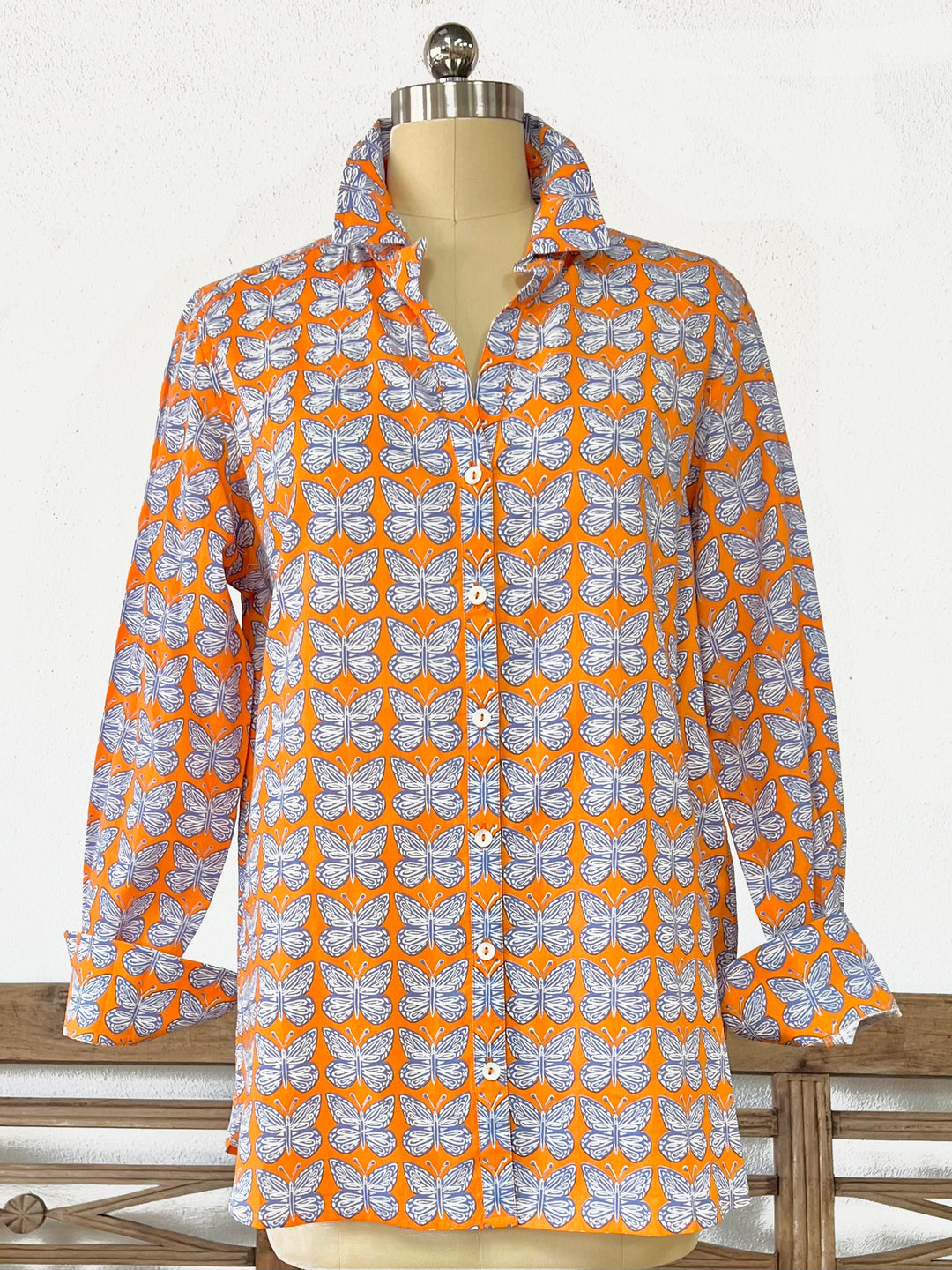 close up of woman in artisan shirt with butterfly print