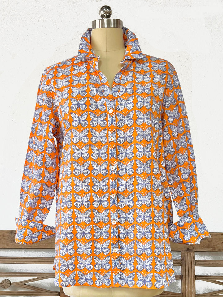 close up of woman in artisan shirt with butterfly print