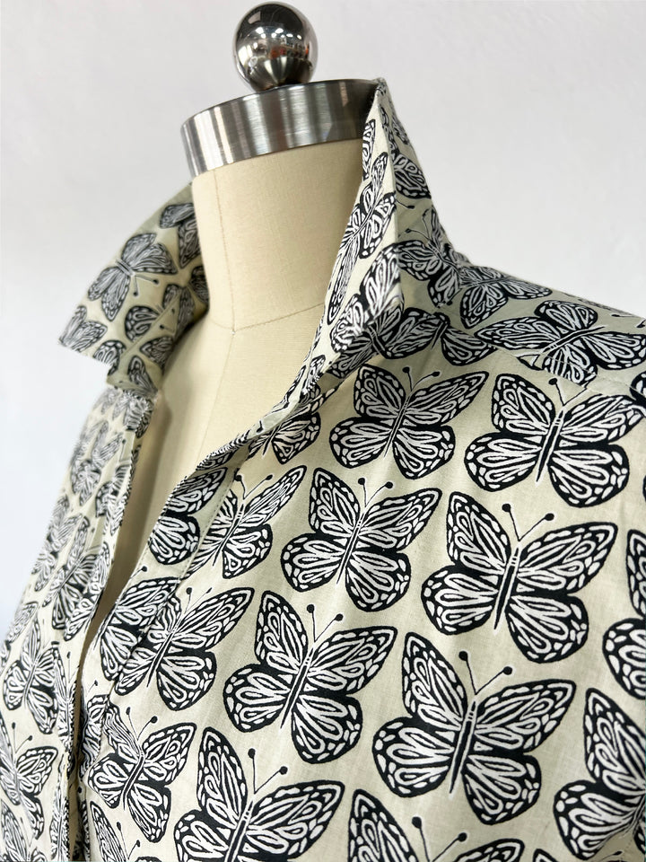 close up of artisan shirt with butterfly print