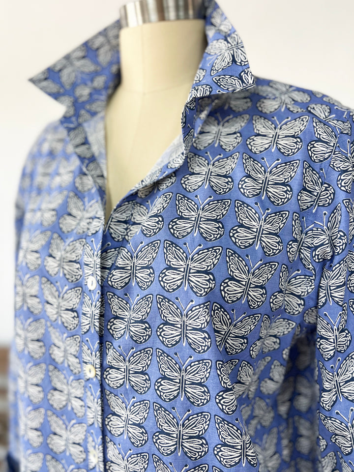 close up of blue artisan shirt with butterfly print