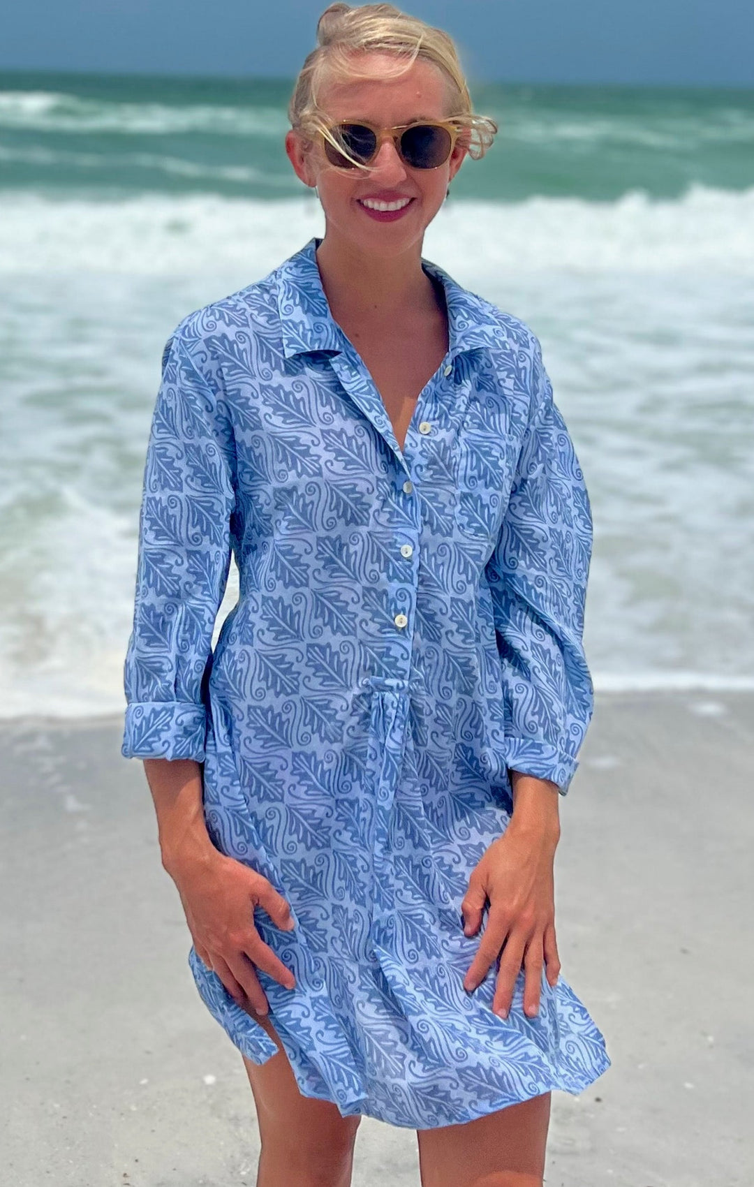 woman in 100% cotton blue dress by the beach