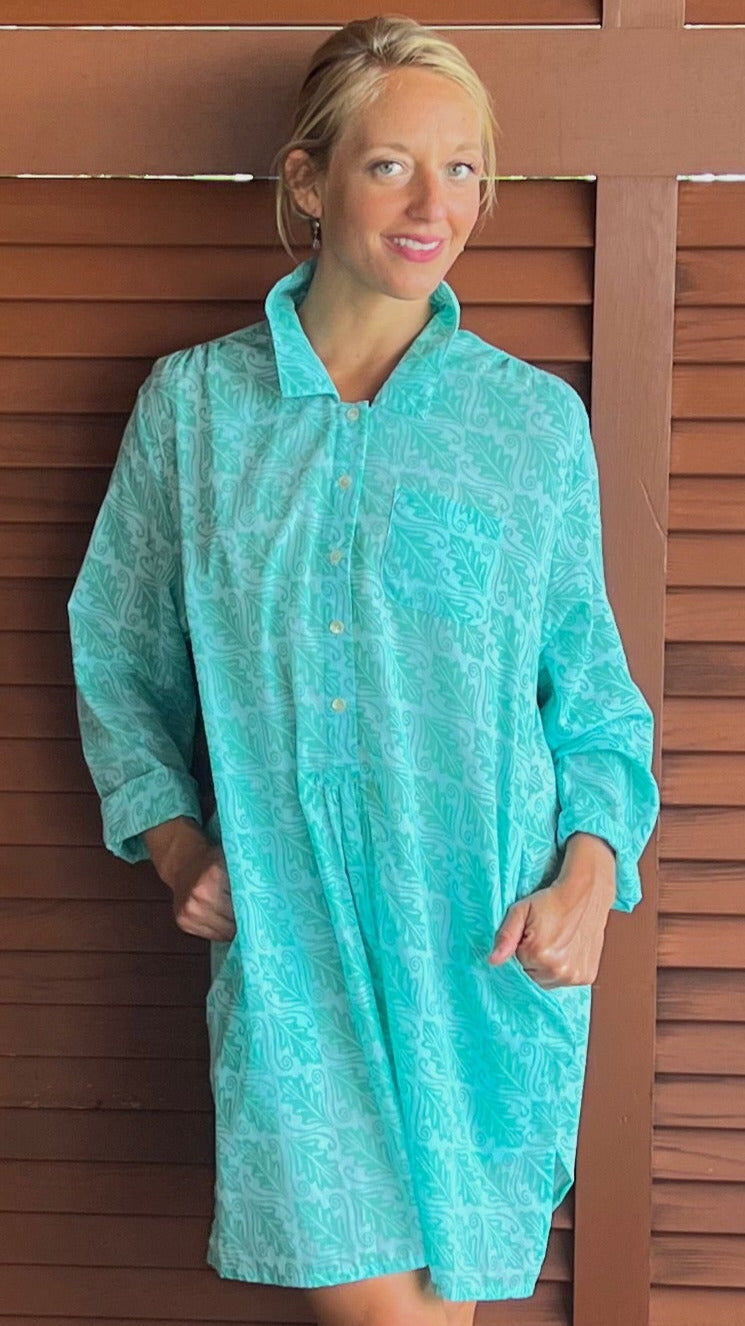 woman in bright blue tunic with sigrid olsen original print