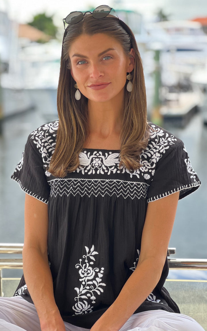 woman in black and white tunic 