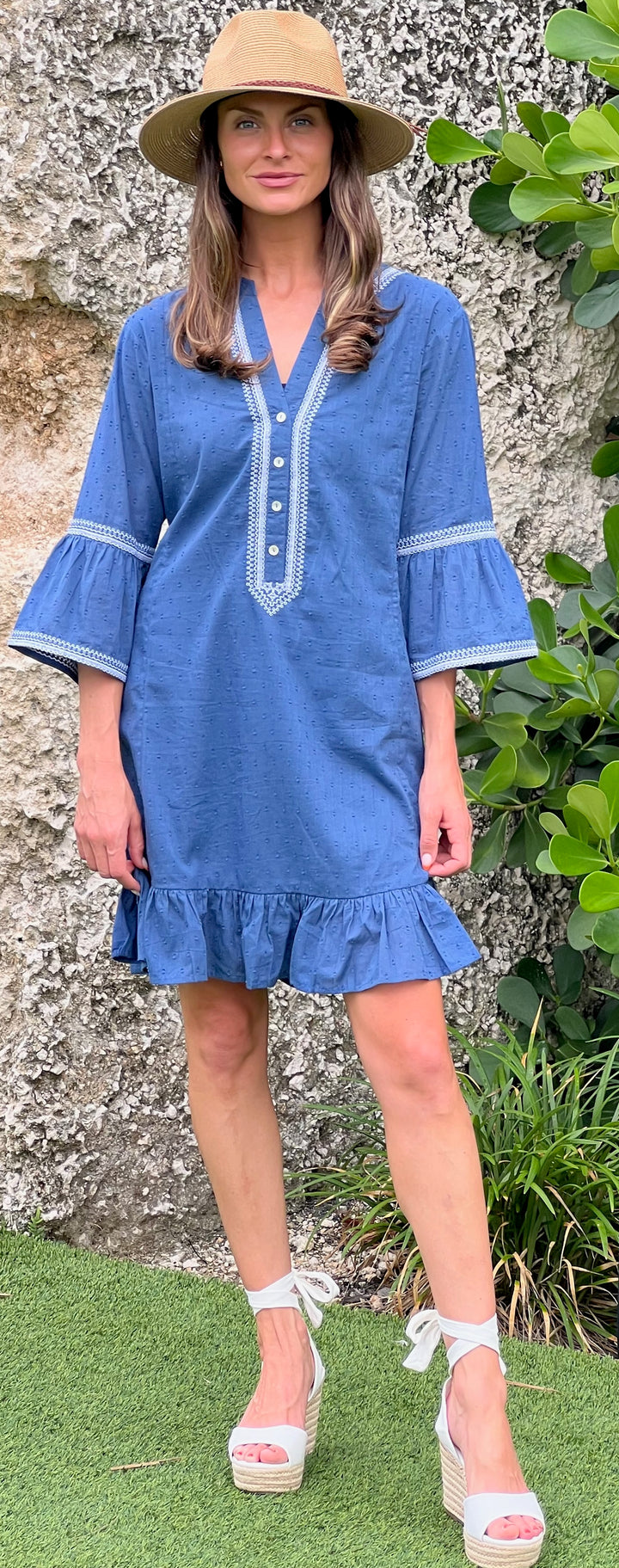 woman in soft blue cotton dress in tropical environment.jpg