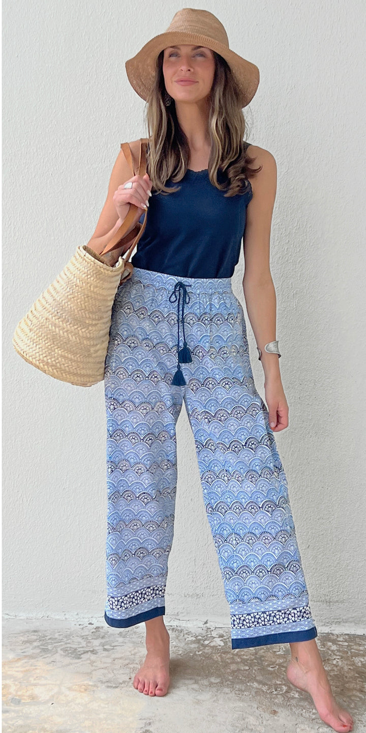 woman in hand-printed navy blue pants