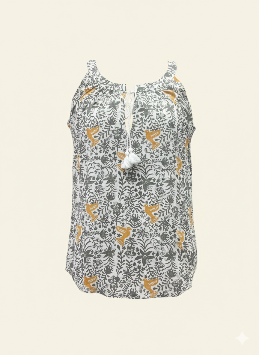 Floral patterned sleeveless top on a beige background