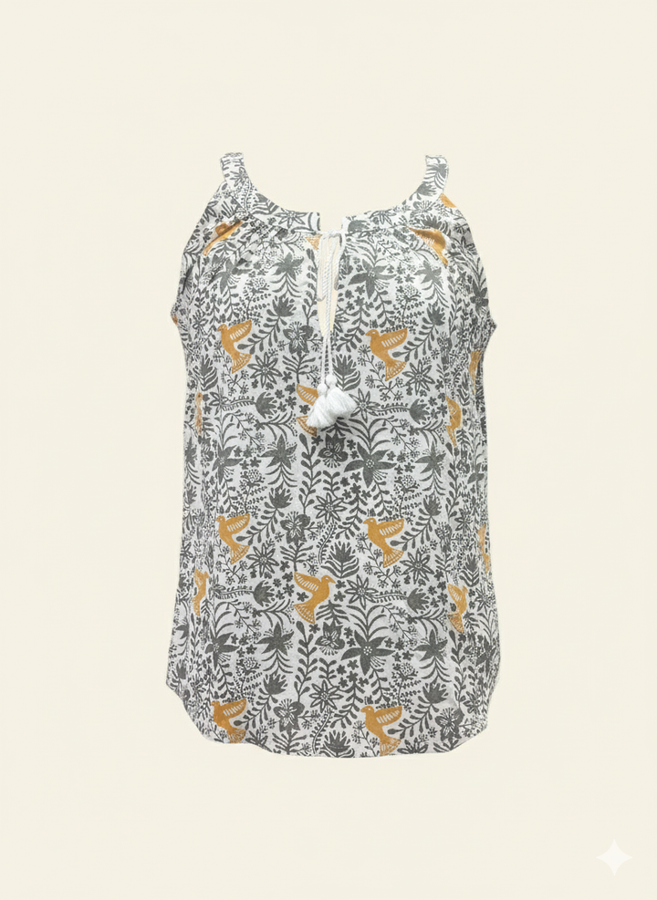 Floral patterned sleeveless top on a beige background