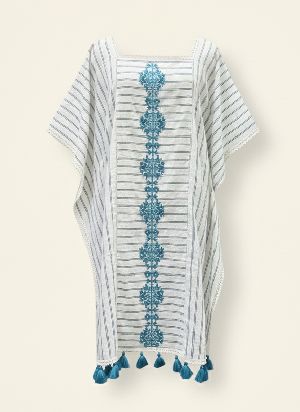 Striped garment with floral patterns and tassels on a beige background