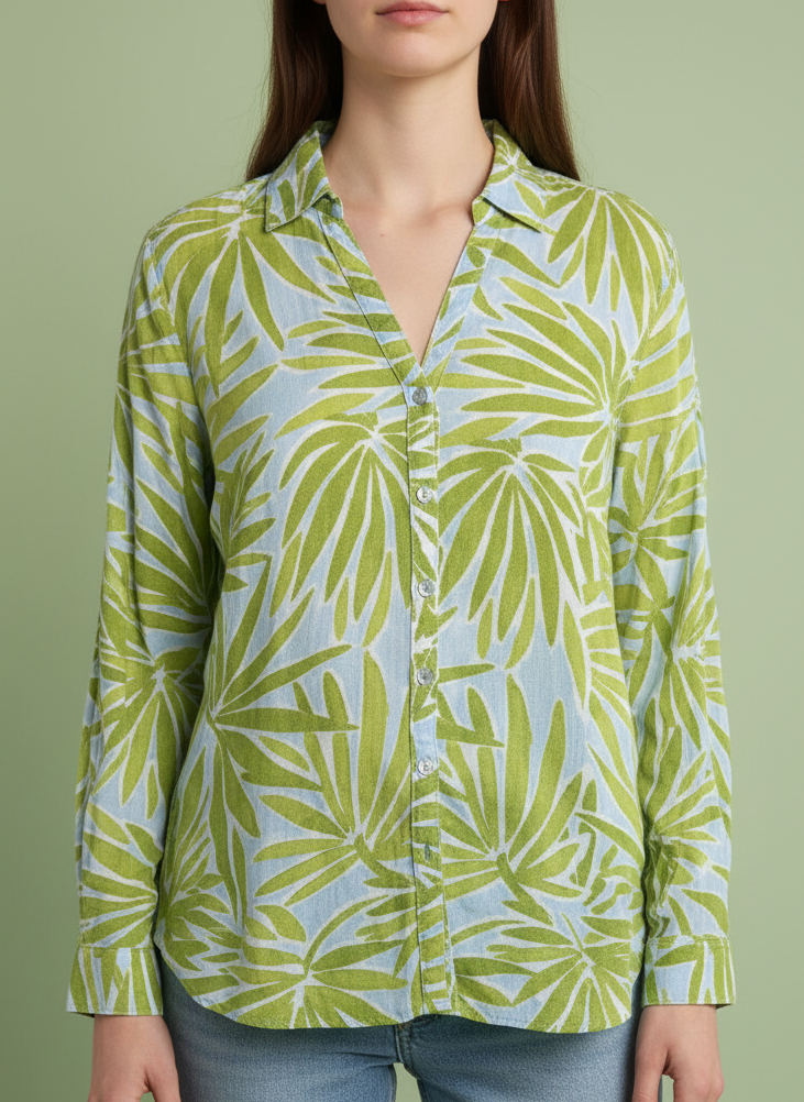 Woman wearing a vintage sigrid olsen shirt against a green background