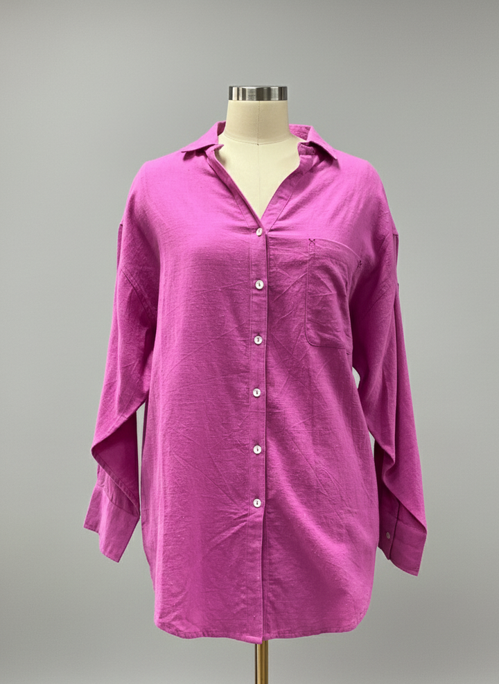 Purple shirt on a mannequin against a gray background