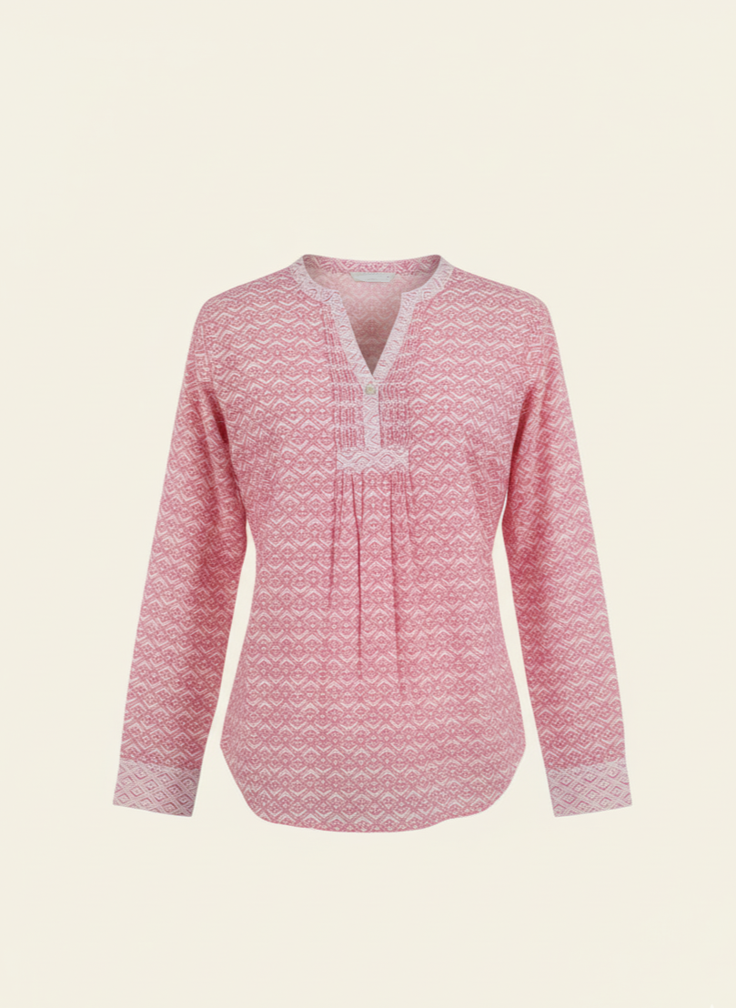 Pink patterned blouse on a light beige background
