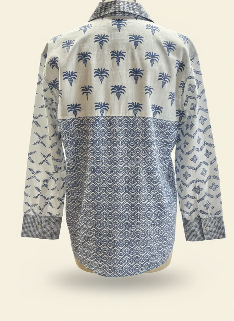 Blue patterned shirt on a mannequin against a white background