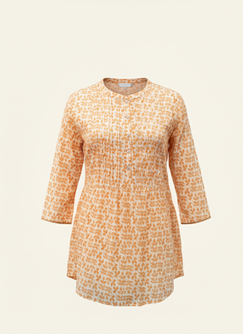 Orange patterned shirt on a beige background