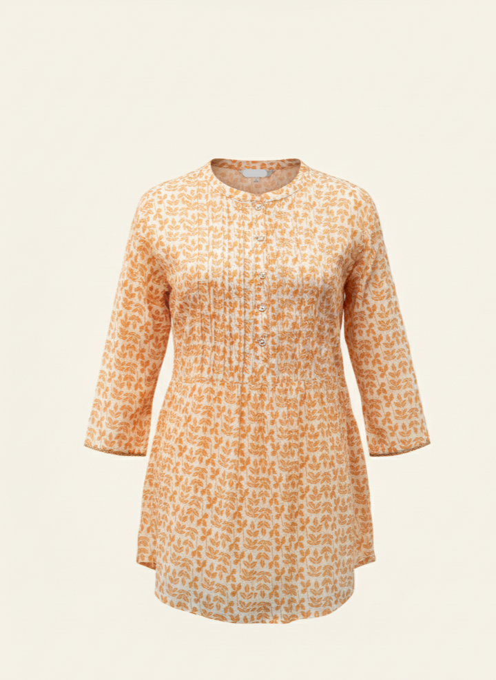 Orange patterned shirt on a beige background