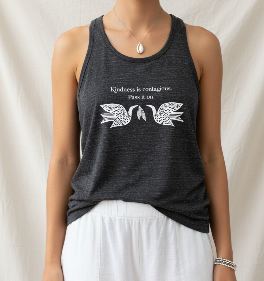 Person wearing a dark gray tank top with a motivational quote and dove design on a plain background