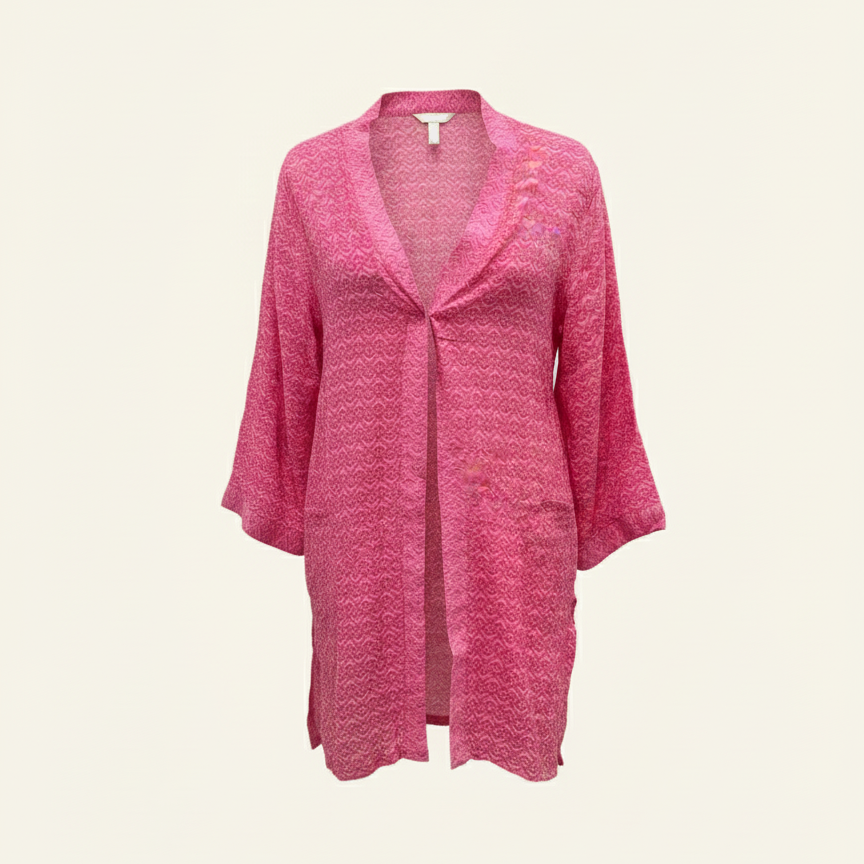 Pink cardigan on a beige background