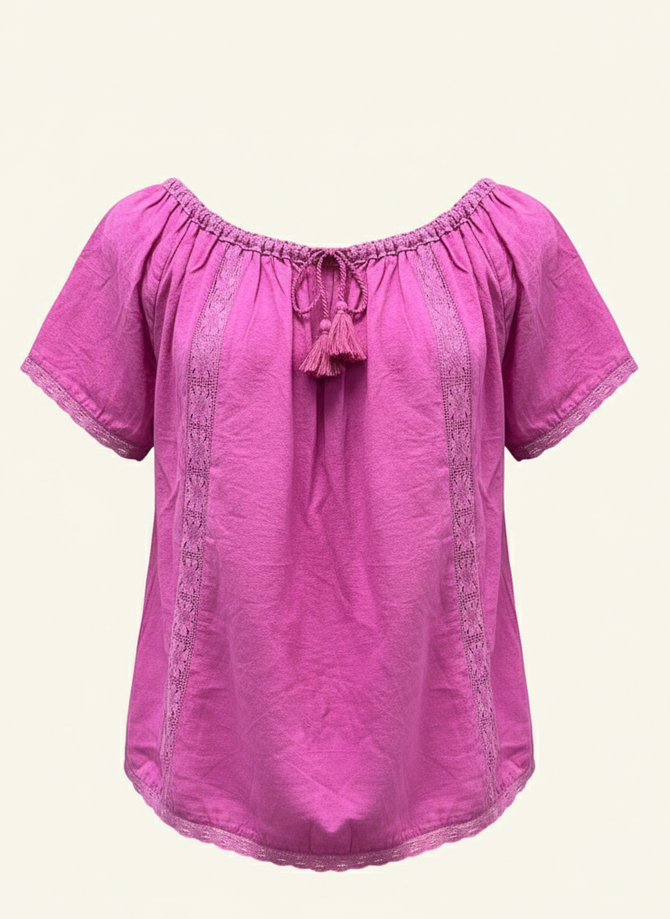 Pink blouse with lace details on a beige background