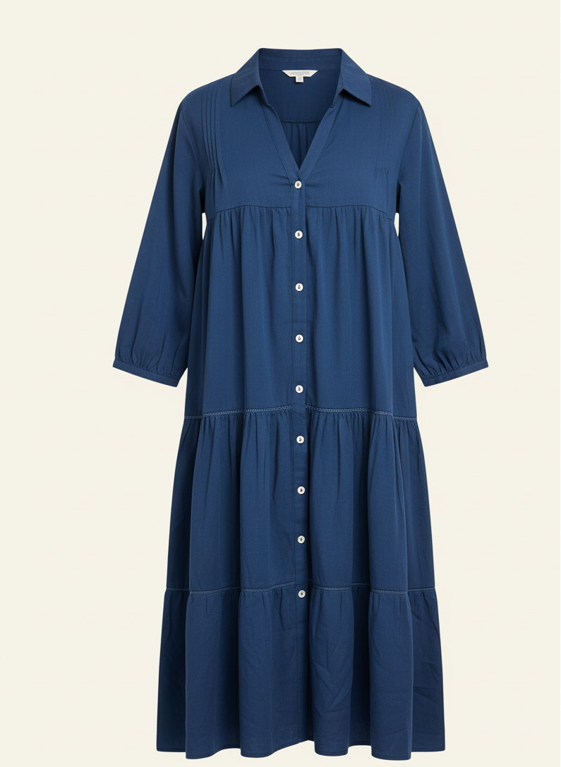 Blue dress with button details on a beige background