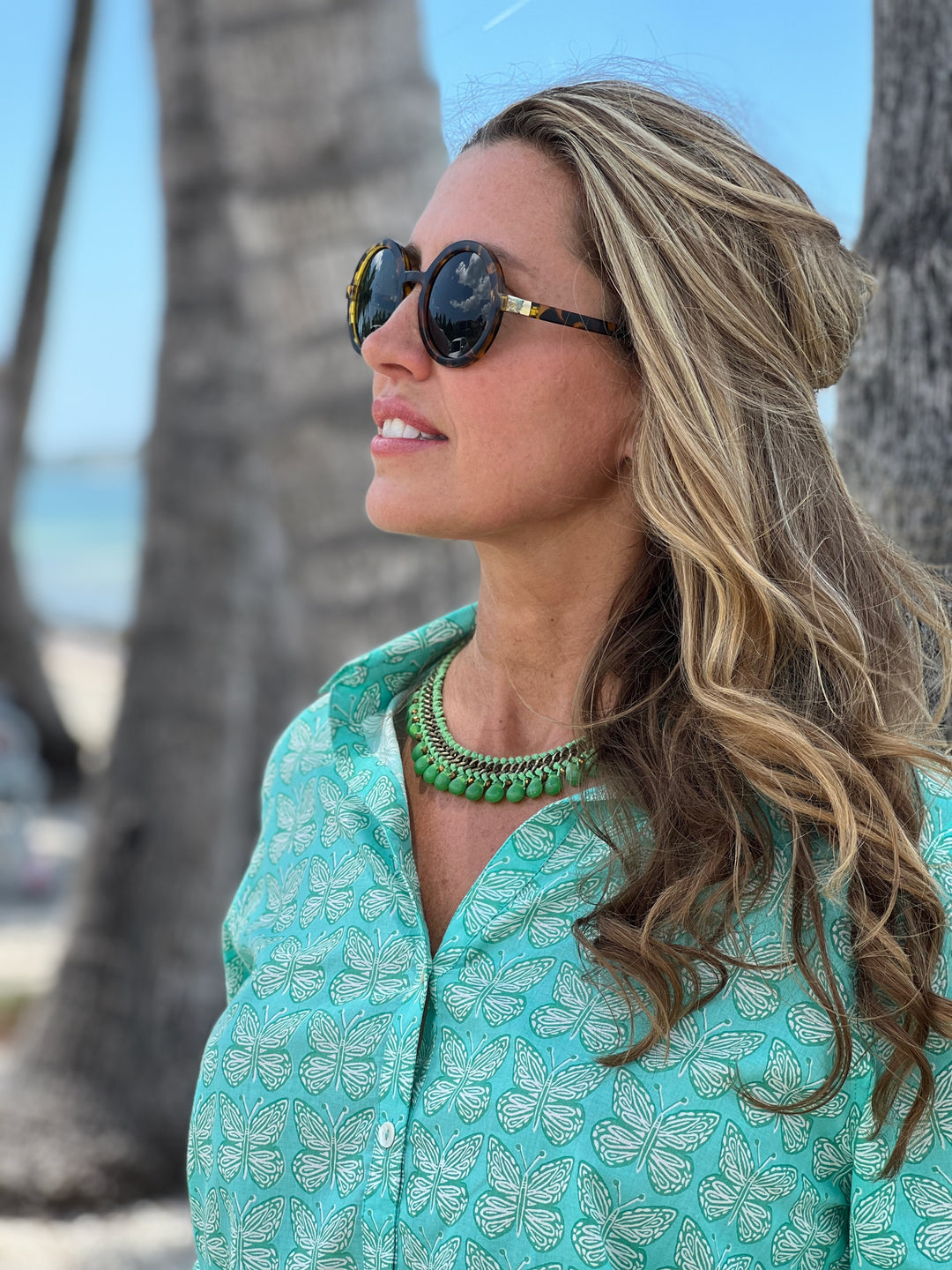 woman in artisan shirt with butterfly print