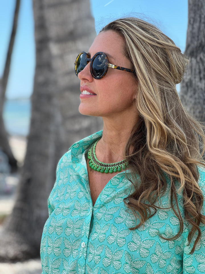 woman in artisan shirt with butterfly print