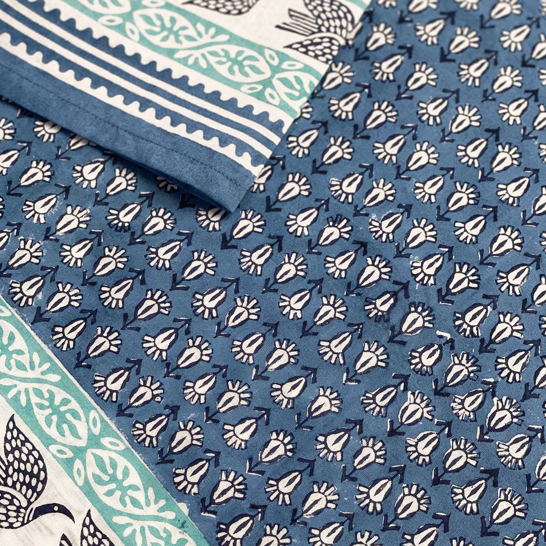 close up of tunic with original hand carved print by sigrid olsen in blue 