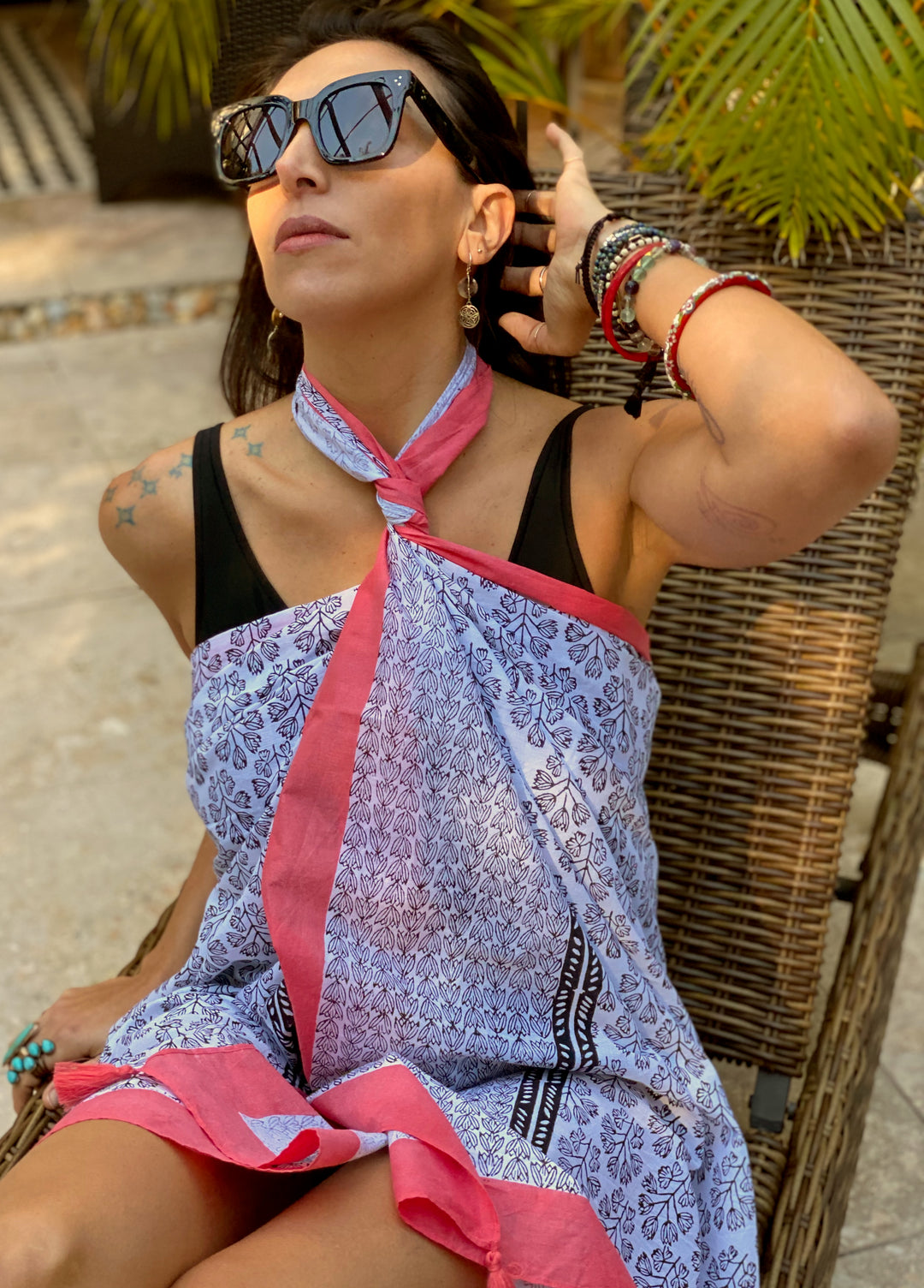 close up of beach wrap and cover up with print in blue and pink