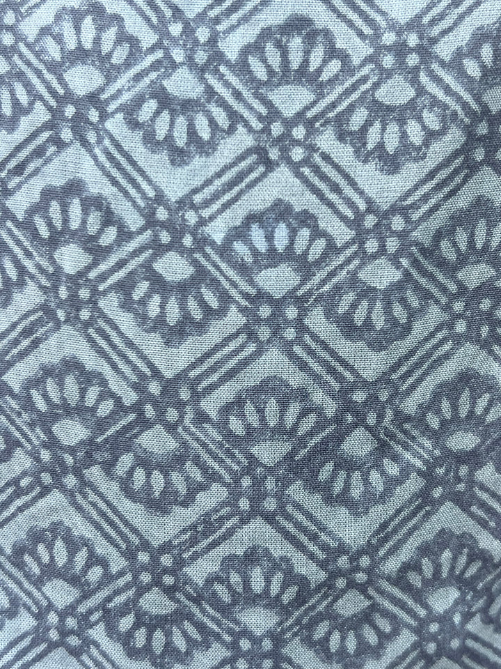 Close-up of a blue fabric with a geometric pattern