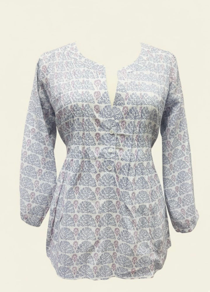 White blouse with blue floral pattern on a white background