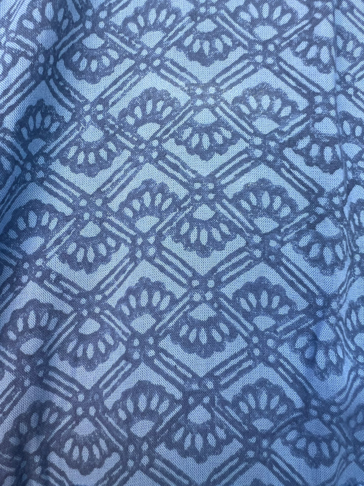 Close-up of blue fabric with a geometric pattern