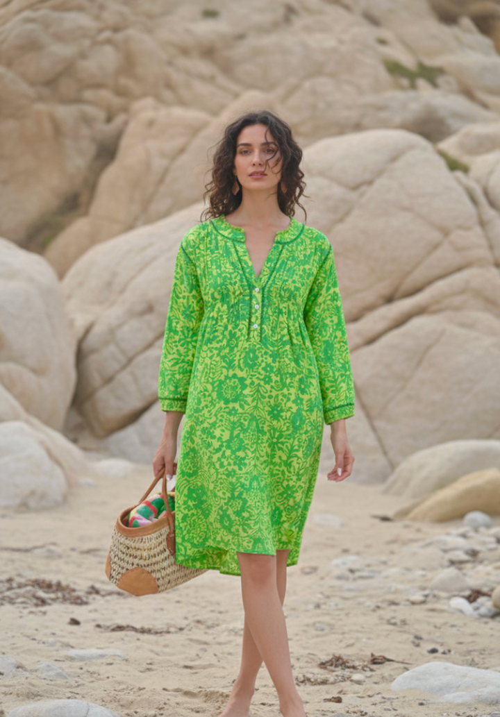 woman wearing a bright green cotton dress