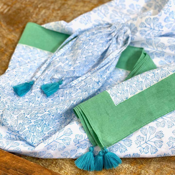 close up of beach wrap fabric cover up in blue and green