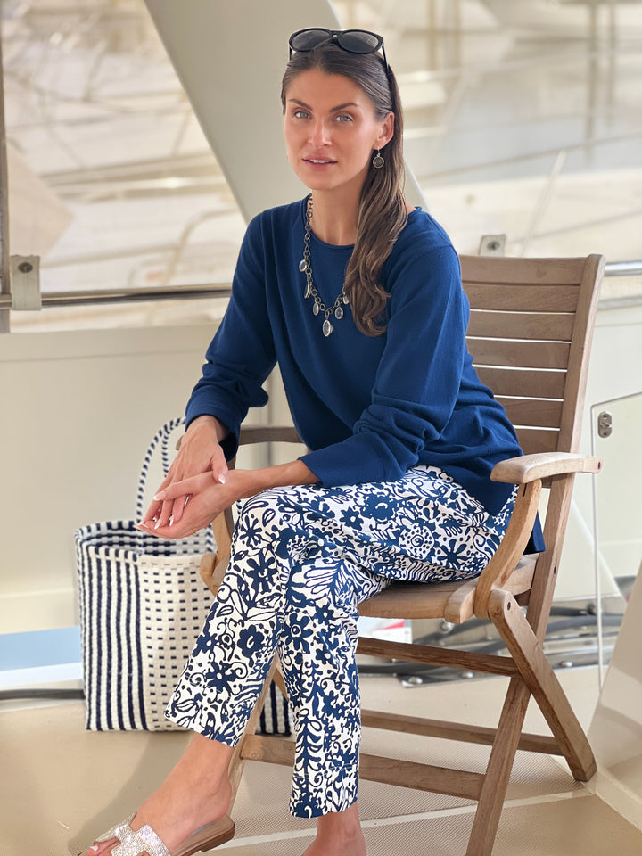 woman in blue and white printed pants 