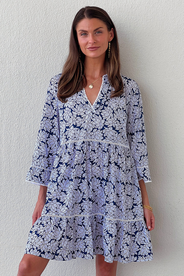 Woman in black and white Morrea dress with floral print.jpg