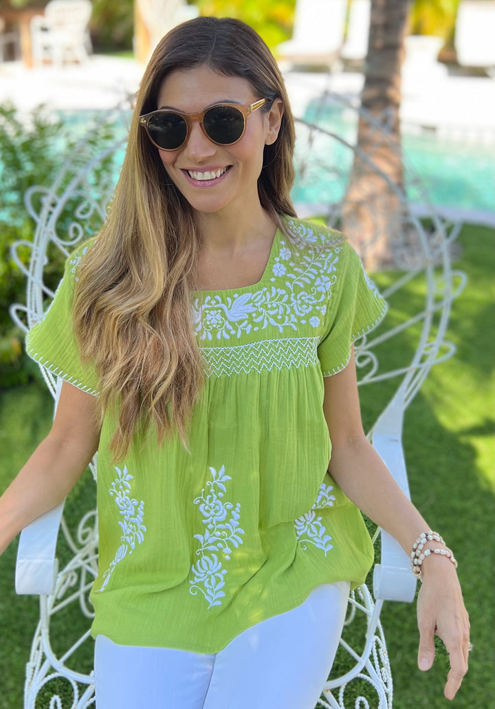 woman in green cotton double gauze top 