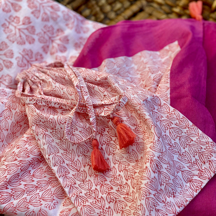 close up of beach cover up with hand printed pattern 